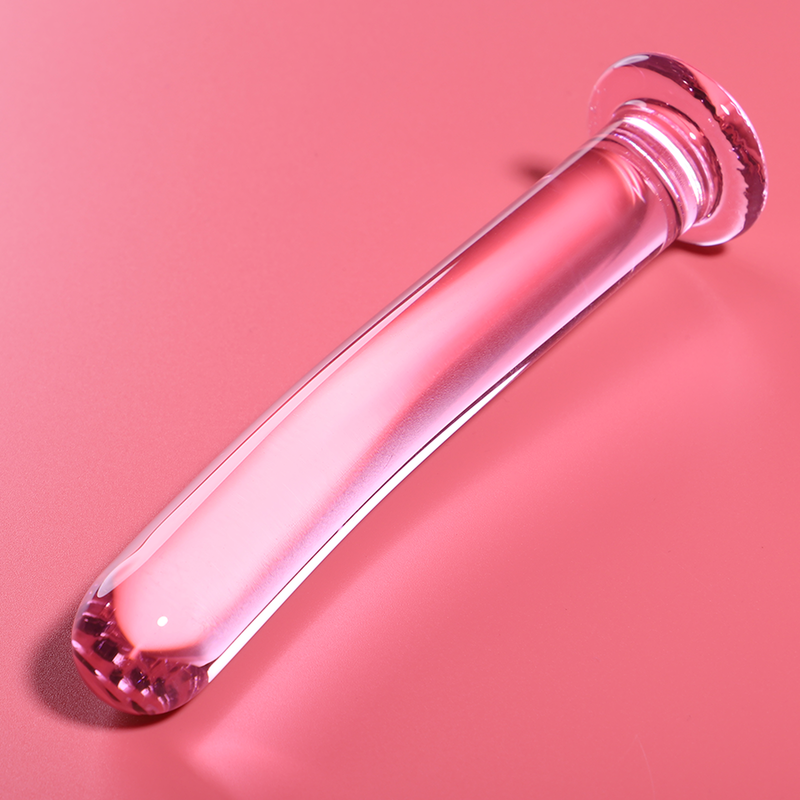 Lasinen NEBULA Dildo NEBULA -merkkinen dildo, pyöreä ja tyylikäs, näkyy selvästi kuvan keskellä.